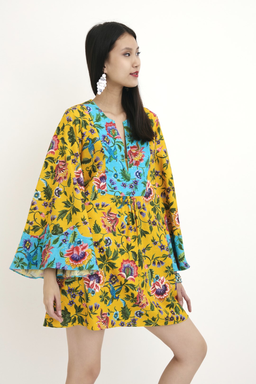 "Handwoven yellow chintz Hand-painted print and blue chintz detailed tunic with hand embroidery in french knots and sequins detail. 100% Handwoven cotton; Lining: 100% cotton 100% Azo Free Dry Clean Only"