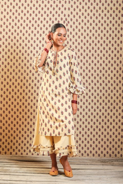 BEIGE SOFT COTTON KURTA PAIRED WITH WIDTH LENGTH PANTS.