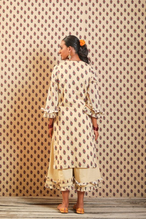 BEIGE SOFT COTTON KURTA PAIRED WITH WIDTH LENGTH PANTS.