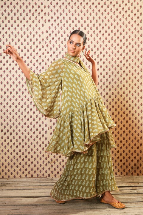 MEHENDI GREEN OFF SHOULDER SWIRLY TUNIC PAIRED WITH PALLAZO PANTS AND DUPATTA.