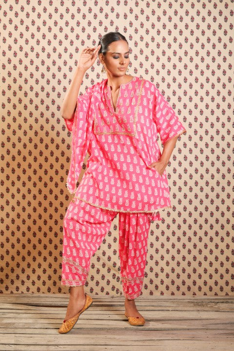 MITHAI PINK KURTA PAIRED WITH SALWAR AND A PRINTED SCARF.