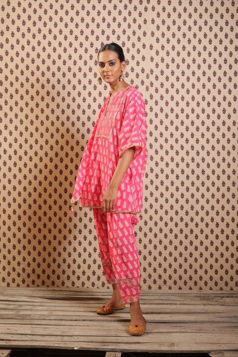 MITHAI PINK KURTA PAIRED WITH SALWAR AND A PRINTED SCARF.