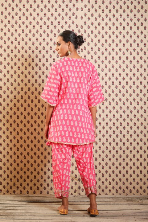 MITHAI PINK KURTA PAIRED WITH SALWAR AND A PRINTED SCARF.