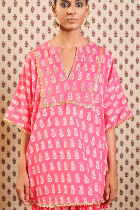 MITHAI PINK KURTA PAIRED WITH SALWAR AND A PRINTED SCARF.