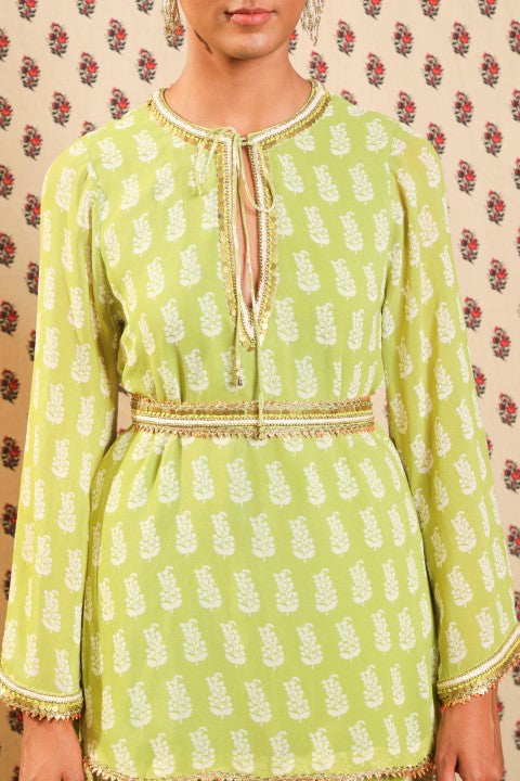 LIME GREEN GEORGETTE KURTA PAIRED WITH STRAIGHT PANTS AND BELT.