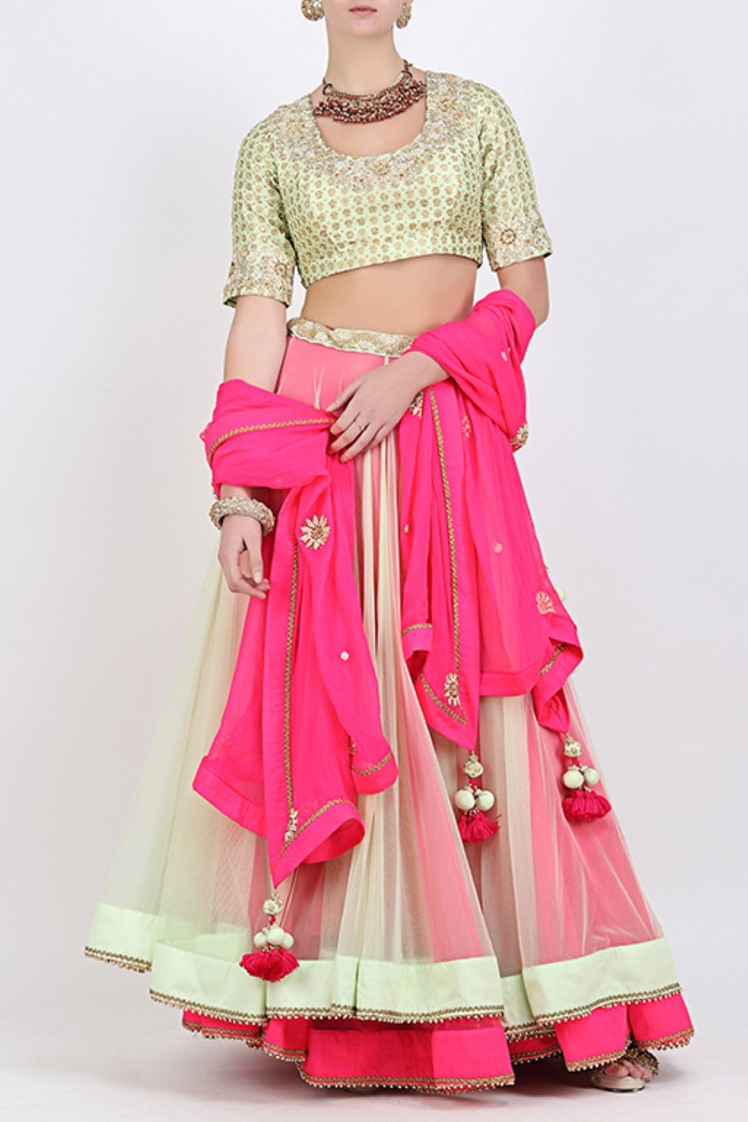 PISTA AND PINK DOUBLE LAYERED LEHENGA WITH EMBROIDERED BLOUSE AND DUPATTA.