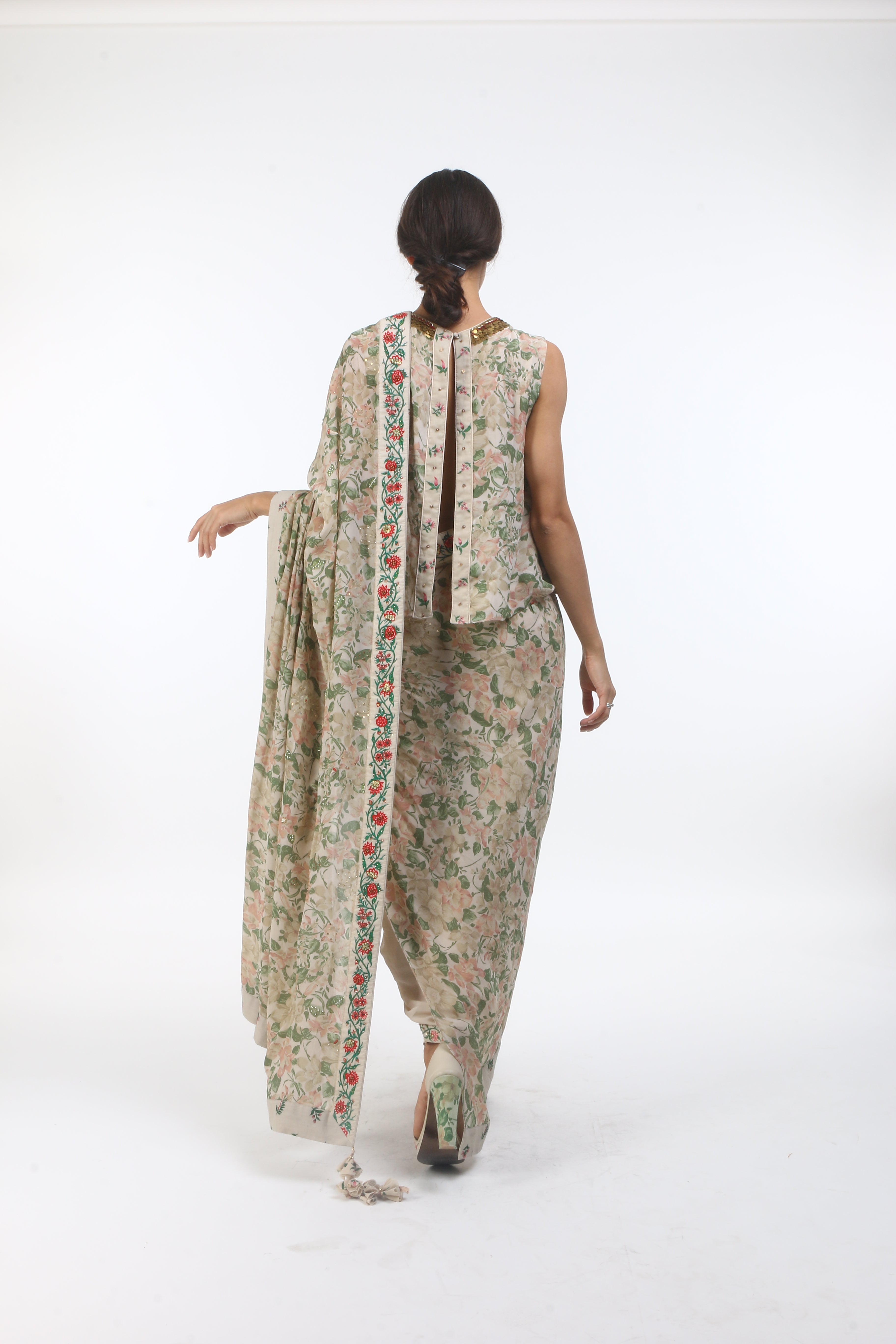 printed and embellished crepe dhoti saree with a back open blouse in layered coin embroidered neckline.