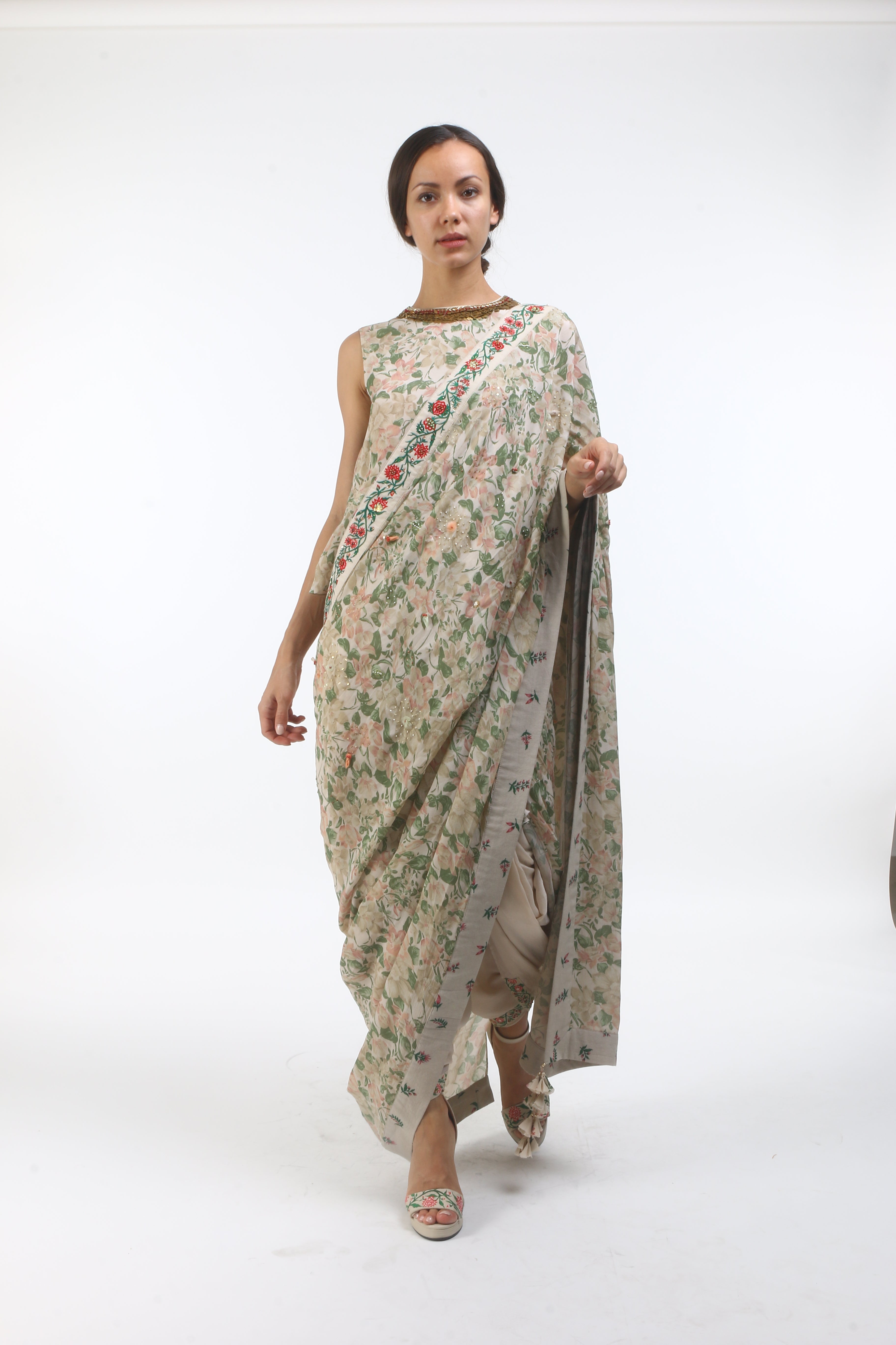 printed and embellished crepe dhoti saree with a back open blouse in layered coin embroidered neckline.