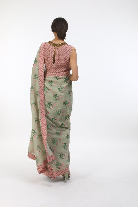 Bloom antique jade hibiscus printed & embellished saree in crepe, with new sanga printed blouse in layered coin embroidered neckline.