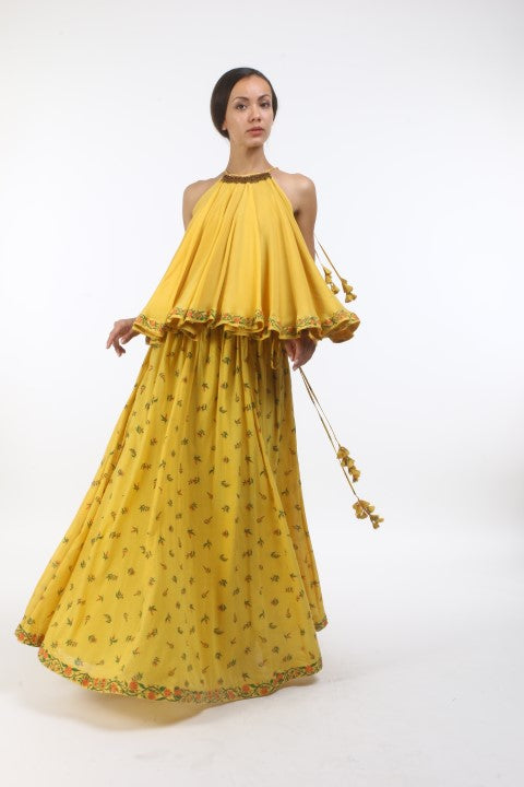 Bloom pitambari yellow flared halter top in crepe, with bouquet printed cotton lehenga in layered coin embroidered neckline.