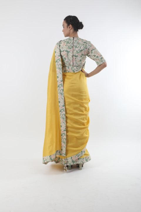 Bloom pitambari yellow chanderi saree in bibi jaal printed border with printed & organza embroidered  cotton blouse.