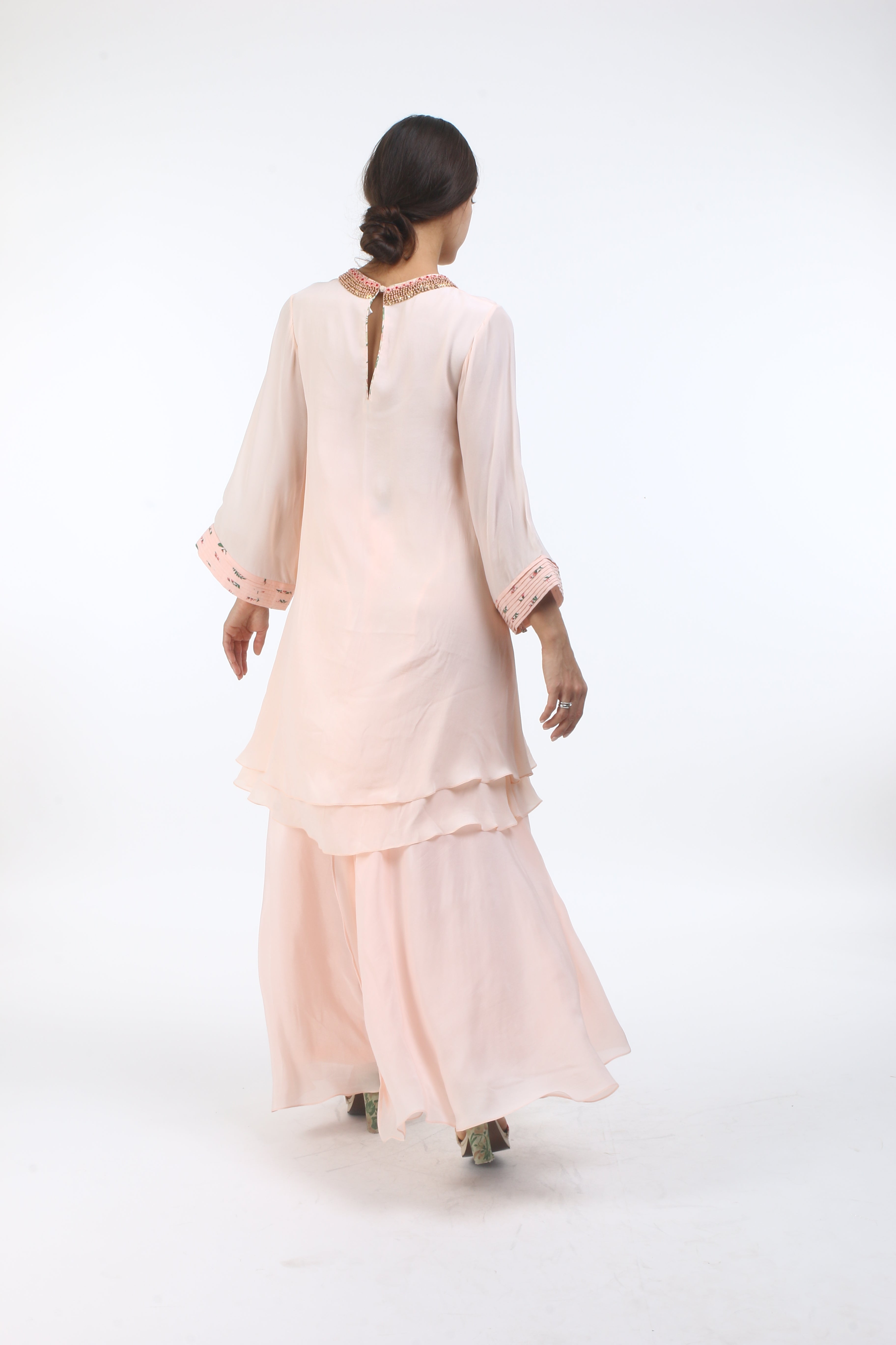 Bloom salmon pink layered tunic with bouquet printed pintuck cuff and french knot embroidered neckline, paired with a front open sharara.