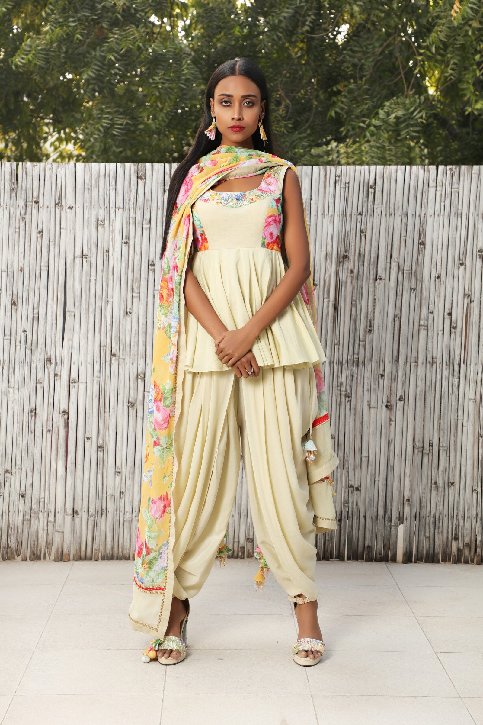 Antique jade cotton silk peplum top teamed with cowl dhoti and an ochre vintage rose dupatta.