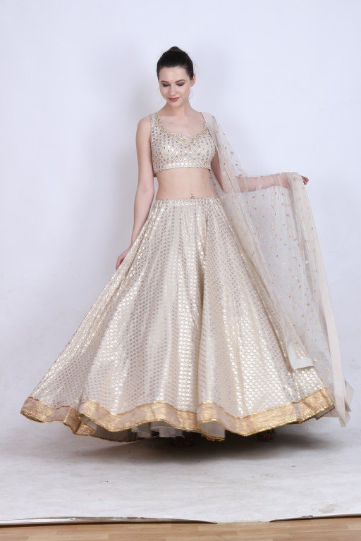 Ghee gold foil printed lehenga with embroidered blouse and embroidered mukesh net dupatta.