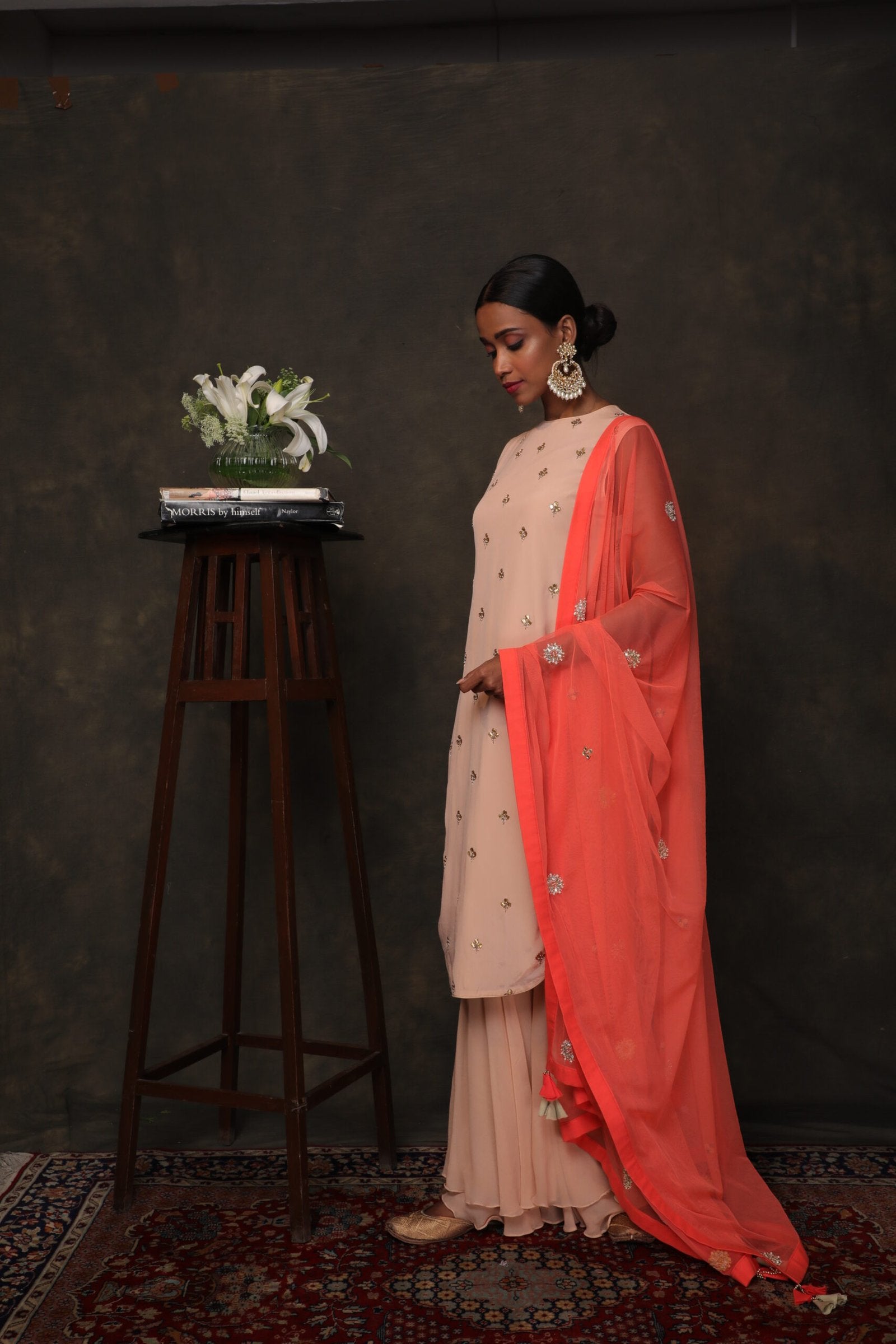 Caramel crepe Kurta with a double layer sharara and coral dupatta