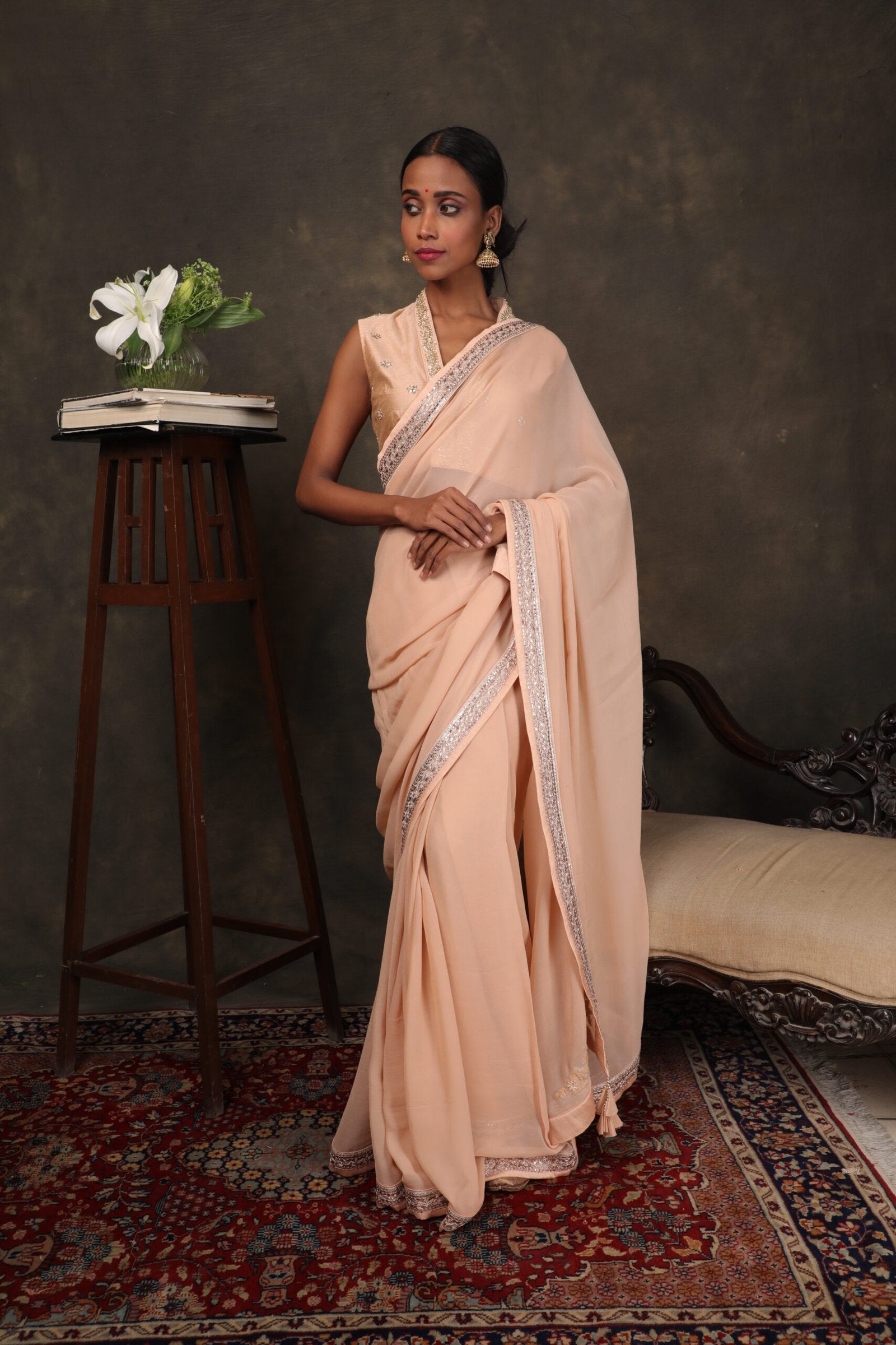 Caramel georgette saree with raw silk blouse.