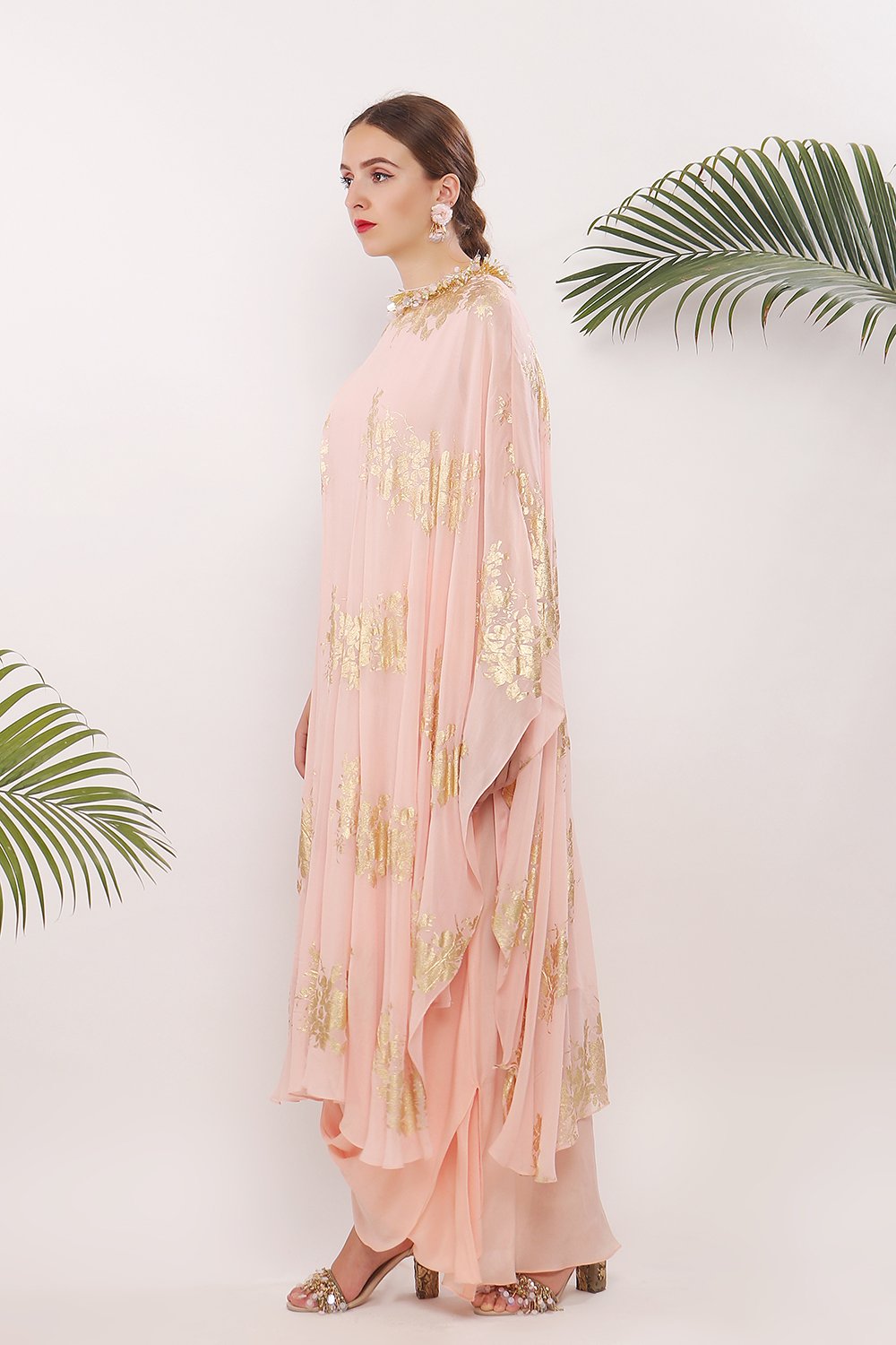 One pleat shoulder kaftan and embroidered neckline along with  cowl skirt